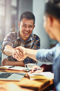 Two men shaking hands.