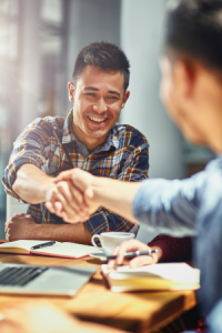 Two people shaking hands.