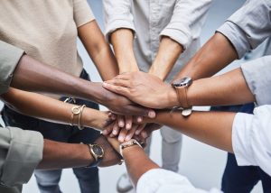 Group of people holding hands in solidarity