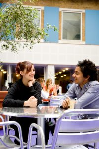 Two employees talking about mental health.